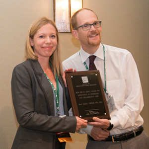 Jame Walker accepting Lipsitt award from Jeff Huffman, 2018
