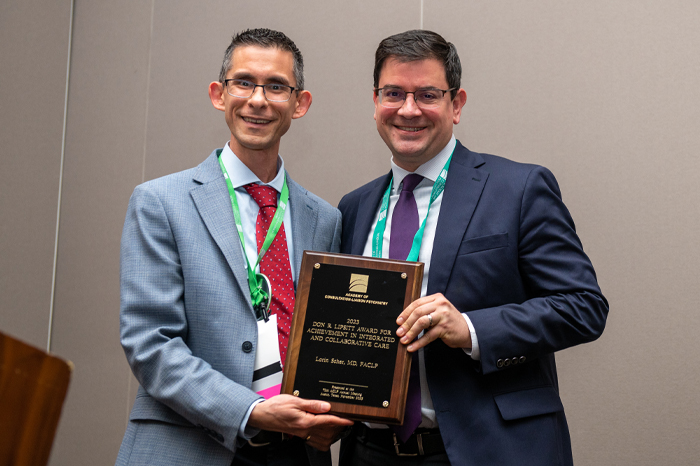 Chris Celano, MD, FACLP presenting the Don R. Lipsitt Award For Achievement in Collaborative Care to Lorin Scher, MD, FACLP